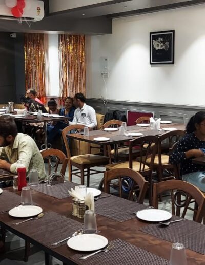 Busy dine-in area of Surat franchise