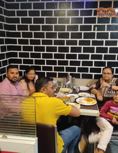 Junagadh's Pandeyji Restaurant's interior with busy BON APPÉTIT consumers.