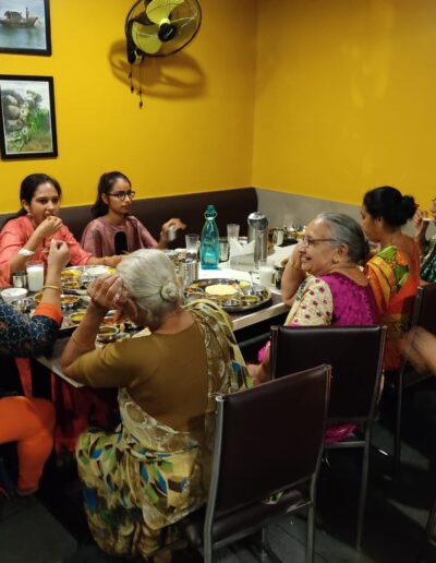 Junagadh's Pandeyji Restaurant's interior with busy BON APPÉTIT consumers.